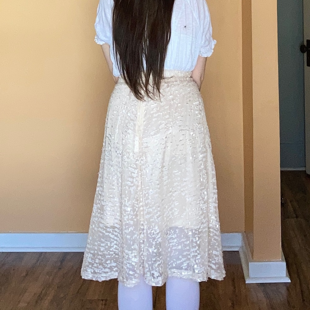 Lace cream colored midi skirt (above the knee).